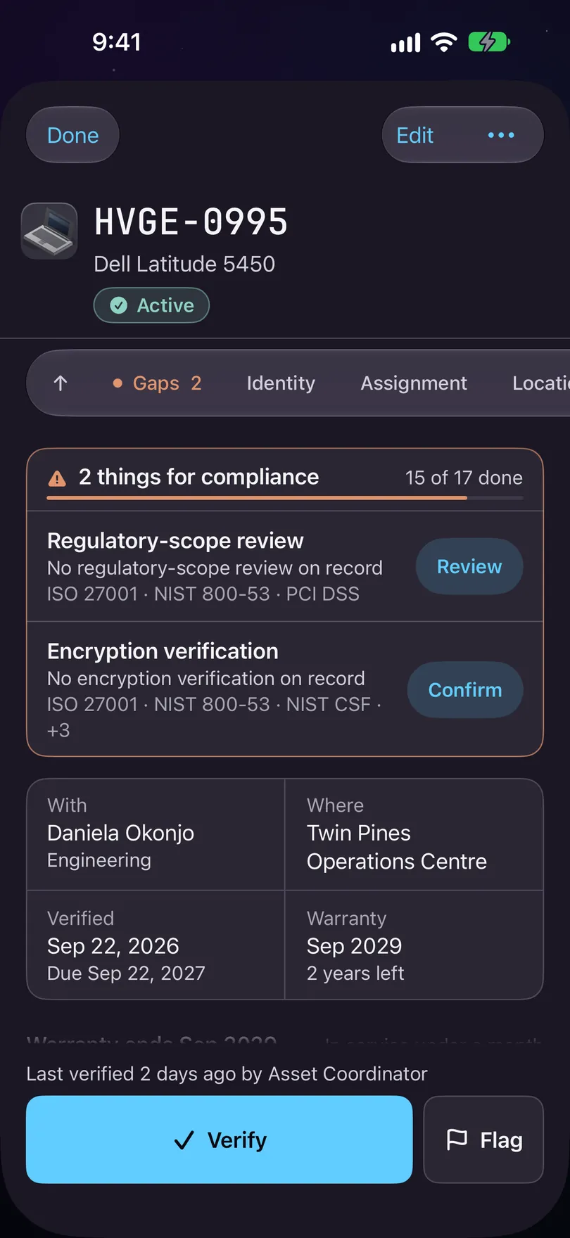 An asset record on iPhone for HVGE-0995, a Dell Latitude 5450, Active: Done, Edit and the ••• button, the jump bar, a card reading 2 things for compliance with Regulatory-scope review and Review, the glance card, and Verify and Flag along the bottom.